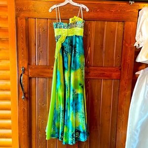 Like new, TonyB, Prom dress with vibrant colors, sure to make an impression.